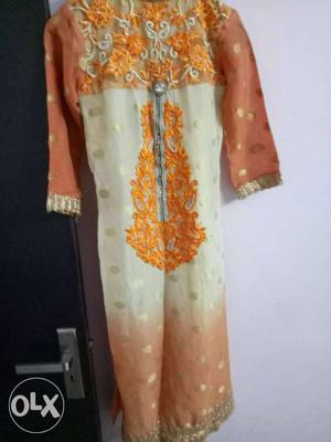 Orange colur party wear suit with plazo and