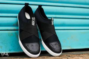 Pair Of Black Slip-on Sneakers
