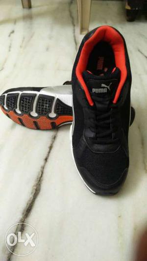 Pair Of Black-and-red Puma Sneakers
