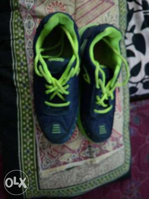 Pair Of Blue-and-green Running Shoes