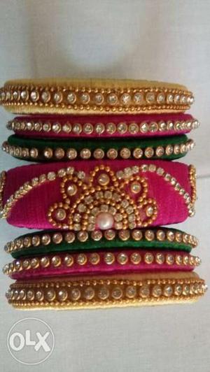 Pair Of Gold-green-and-pink Jhumka Bracelets