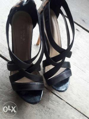 Pair Of Gray And Black Strapy Heels