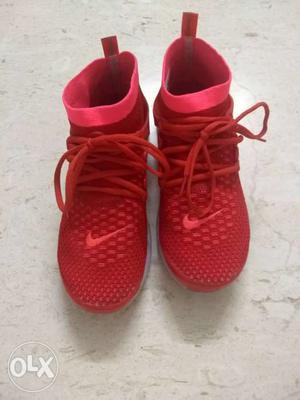 Pair Of Red Nike Sneakers