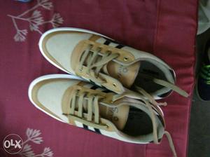 Pair Of White-black-and-brown Low-top Sneakers