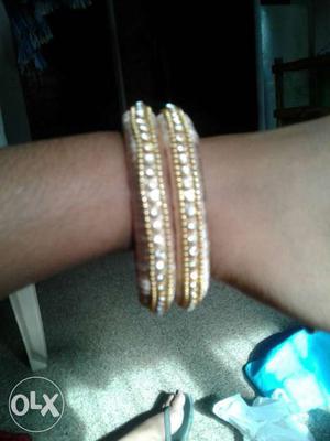 Two Gold, Pink And White Bangles