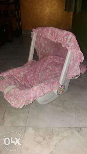 Baby's Pink And Grey Car Seat