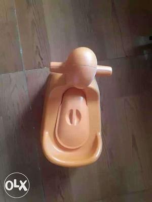 New Toddler's Orange Potty Trainer with detatchable tray.