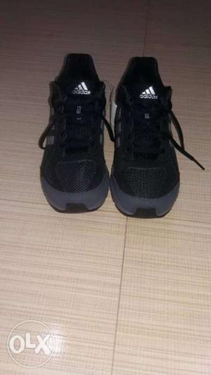 Pair Of Black Adidas outdoor shoe