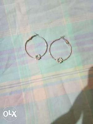 Pair Of Diamond Embellished Silver Hoop Earrings