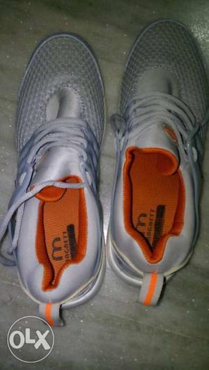 Pair Of Gray-and-orange Running Shoes