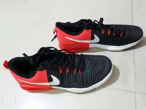Pair Of Red-and-black Nike Low-top Sneaker