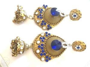 Pair of blue stone earrings hanging