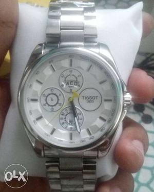 Round Gray Tissot Chronograph Watch With Silver Link