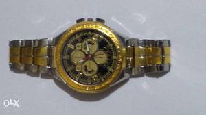 Round Silver And Gold Chronograph Watch
