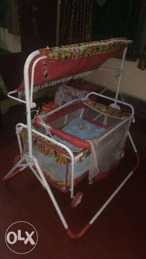 Baby's Multi Color cradle with mosquito net...with wheel