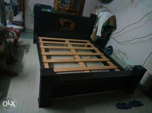 Black And Brown Wooden Bed