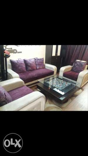 Five(5) seater sofa set with center table in a