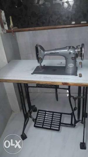 Gray And White Treadle Sewing Machine