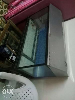 It is a fish tank with steel stand in a good