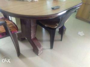 Oval Top Brown Wooden Dining Table