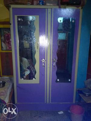 Purple And White Wooden Closet With Mirror Panel
