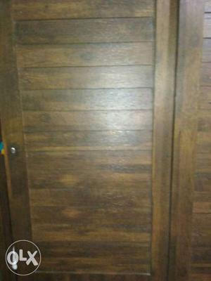 Sliding cupboard in brown color