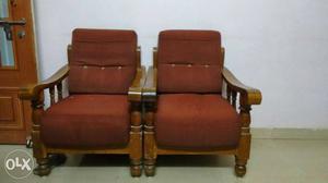 Two Brown Wooden Framed Brown Fabric Padded Armchairs