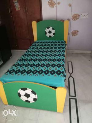 Yellow And Green Wooden Bed Frame With Mattress