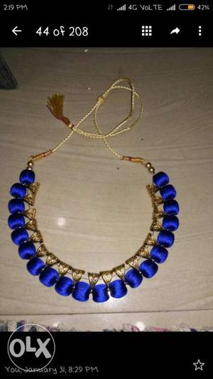 Blue And Gold-colored Bib Necklace and bangles available on