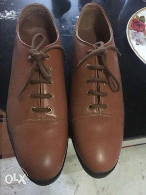 Koovs Tan brown foux leather dearby shoes. Round