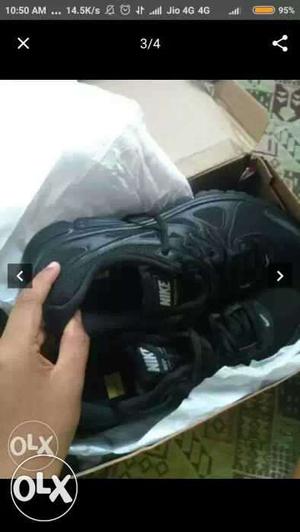 Pair Of Black Nike Shoes In Box