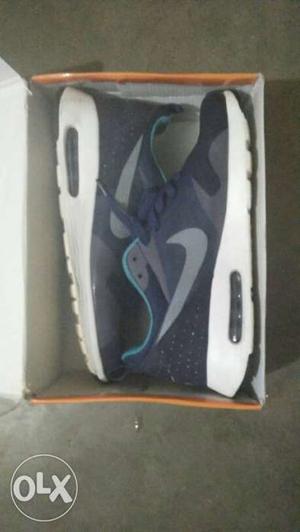Pair Of Blue-and-white Nike Sneakers In Box