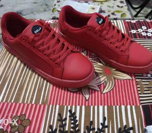 Pair Of Red Sneakers