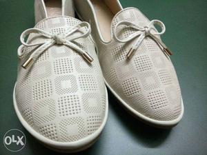 Pair Of White Perforated Leather Low Top Sneakers