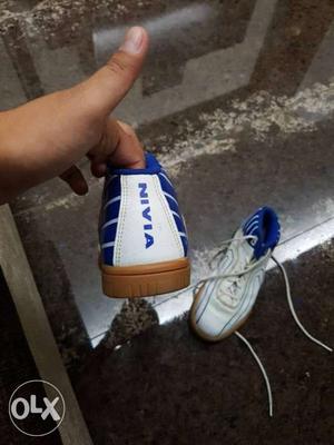Pair Of White-and-blue Nivia Athletic Shoes