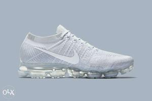 Paired White Nike Running Shoe