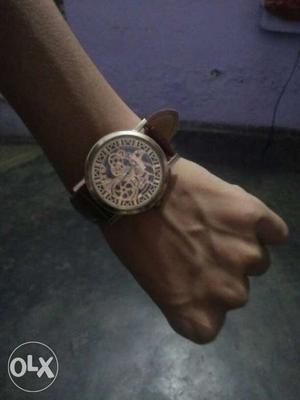 Round Silver And Brown Skeleton Watch