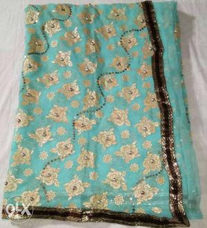 Teal And Beige Floral Textile
