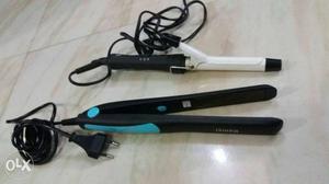 Two White And Black Hair Curler And Flat Irons
