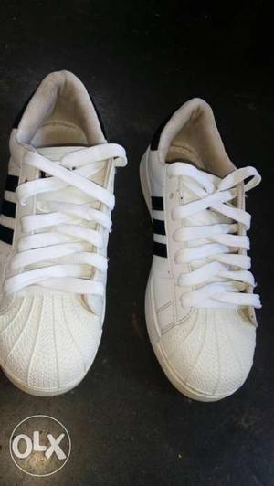 White-and-black Adidas Superstar Sneakers