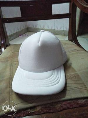 White cap. still new. cotton plus net wala hai. Super