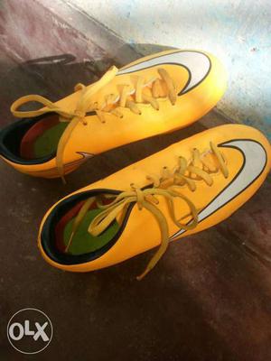 Yellow-and-white Nike Cleats