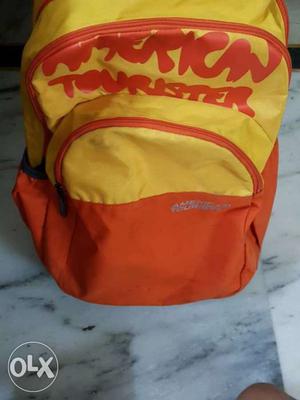 American tourister yellow And Red Backpack with warranty