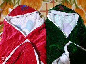 Baby's Red And Green Swaddle with more clothes