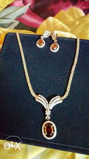 Gold Oval Pendant Necklace With Pair Of Earrings