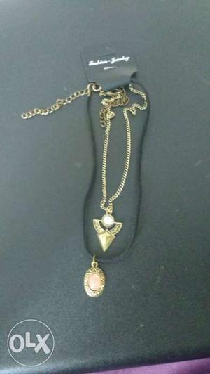 Gold and black chain pendant choker