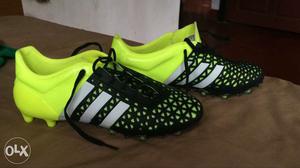 Pair Of Black-and-green Adidas Cleats