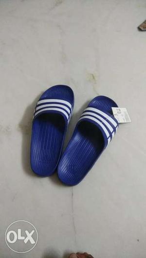 Pair Of Blue Adidas Slide Sandals