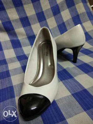 Pair Of Women's White-and-black Leather Pumps