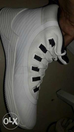Paired White And Black Basketball Shoes